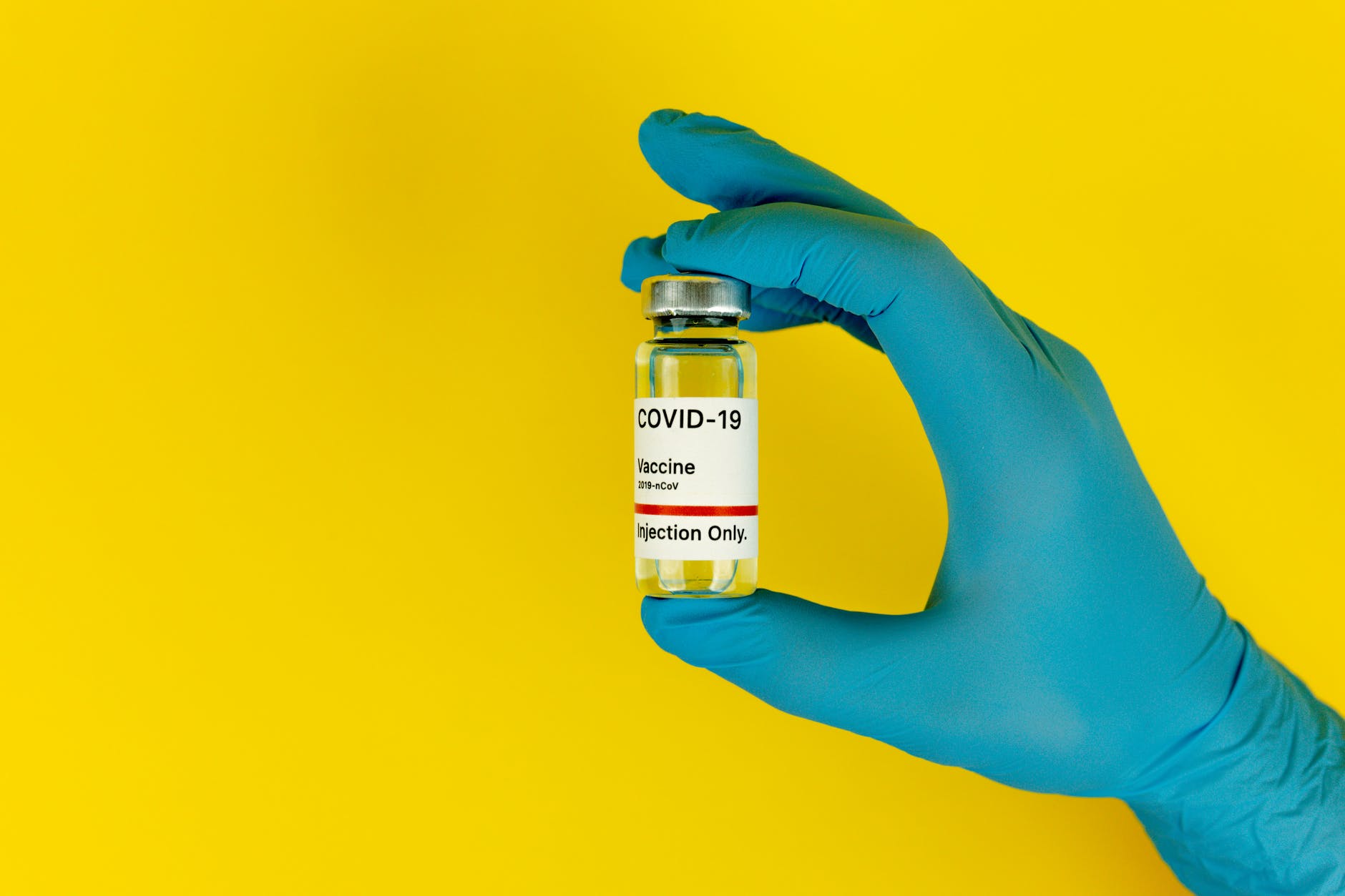 person holding a covid vaccine