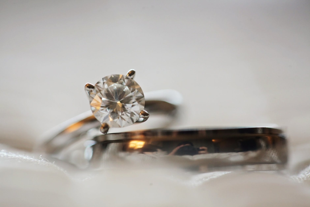 close up photo of diamond stud silver colored eternity ring