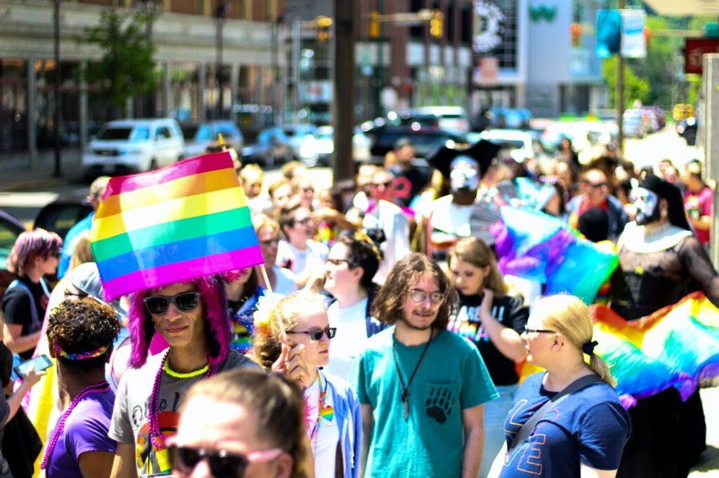 crowd walking at the sidewalk