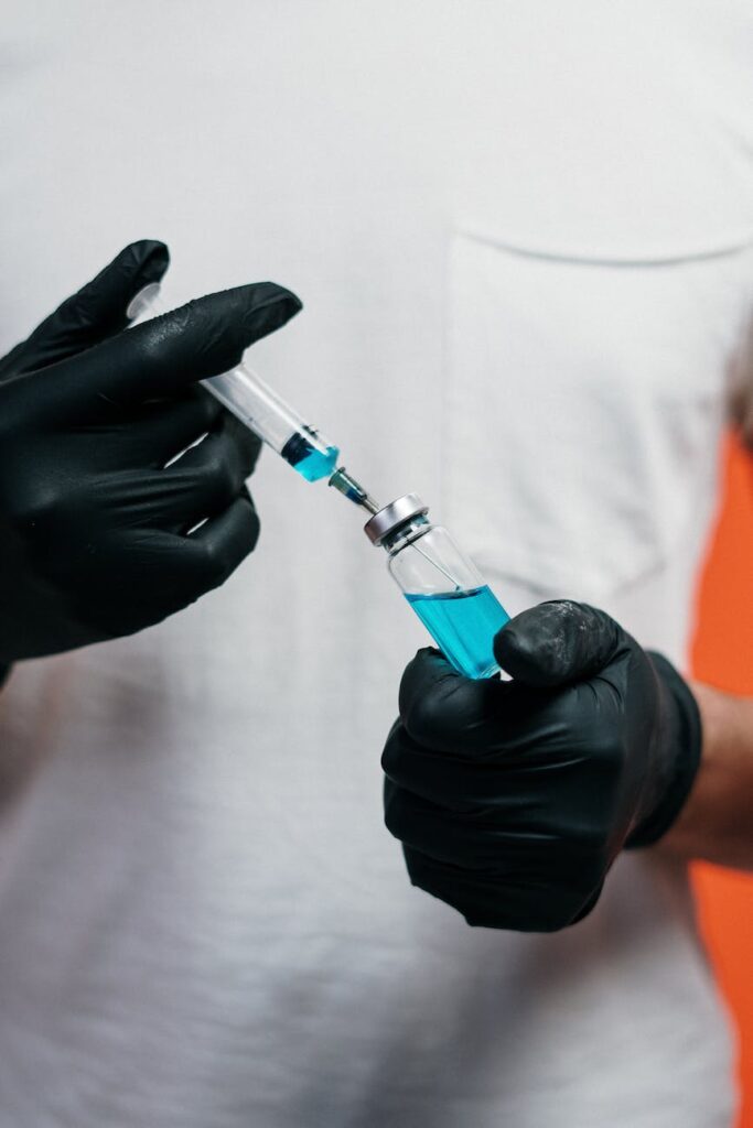 person holding a vaccine