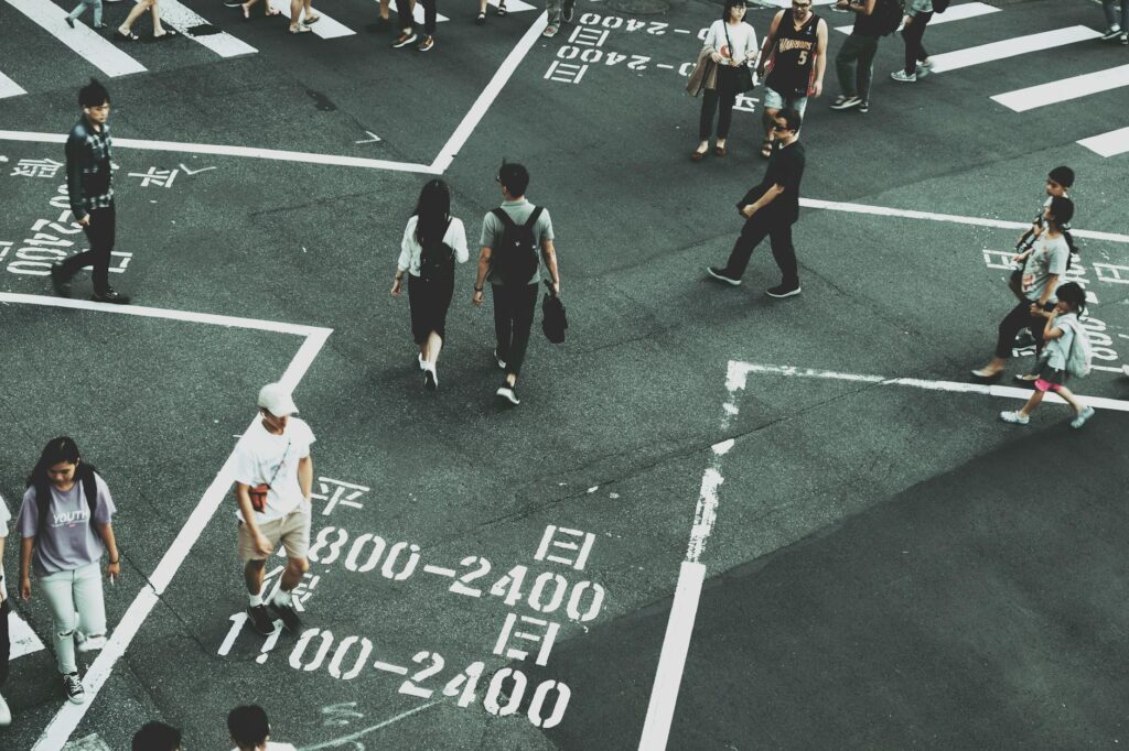 people standing on road close up photography