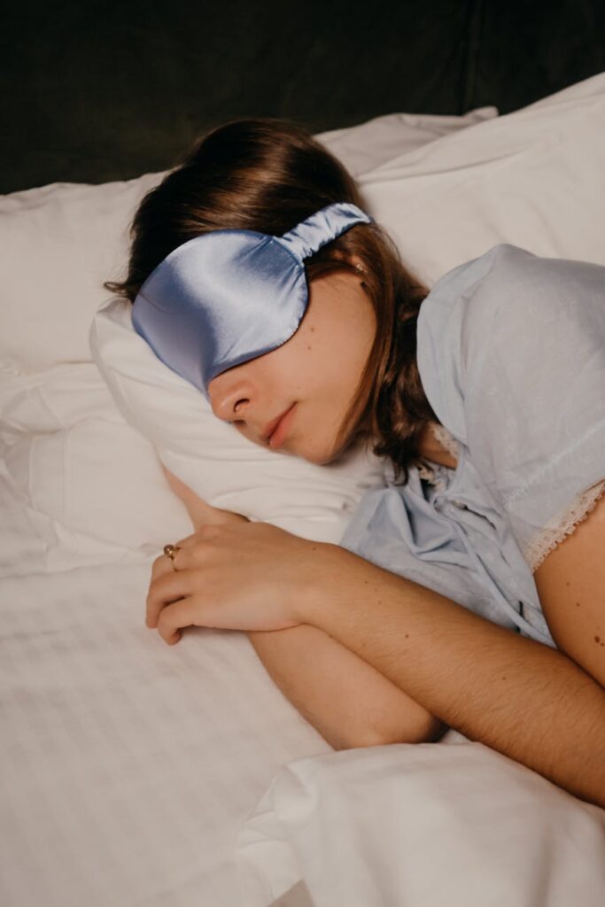 asleep woman wearing eye sleeping mask